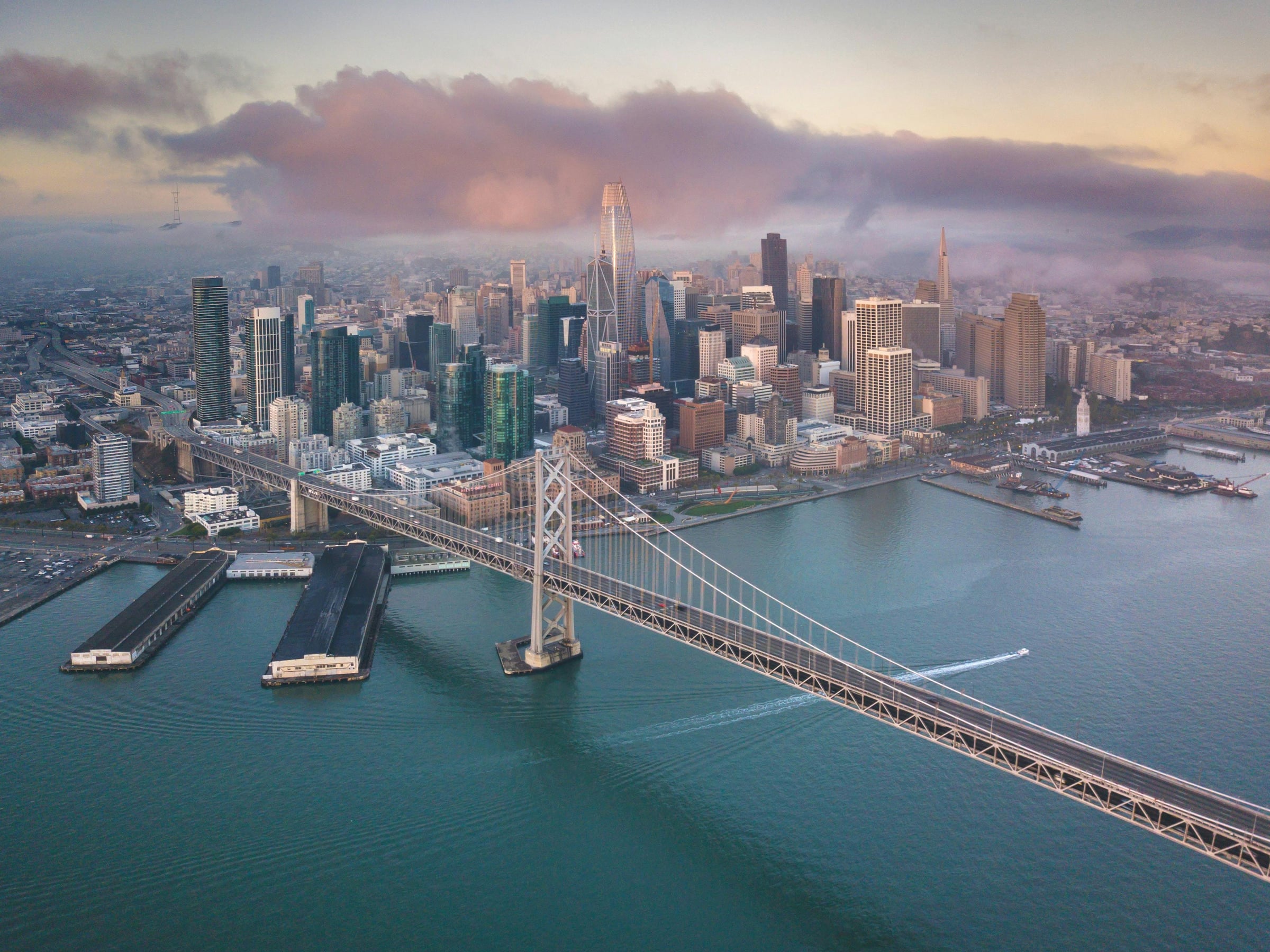 Luxury sedan crossing Golden Gate Bridge in fog